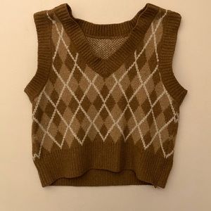 Brown vest  it’s in good condition it’s kinda soft and not itchy never been worn